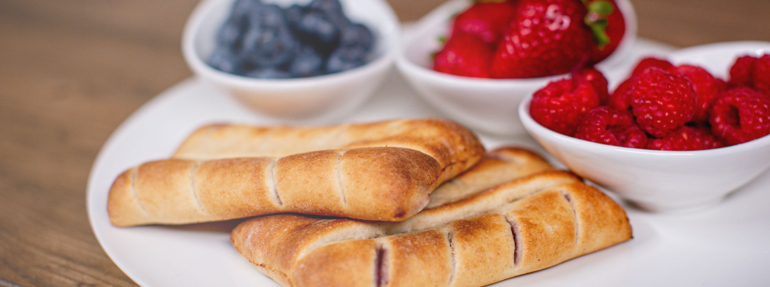 Berries & Cream Twin Breadstick Pastry with 3 side dishes: blueberries, strawberries and rasberries